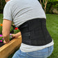 Person wearing a lumbar back brace while gardening